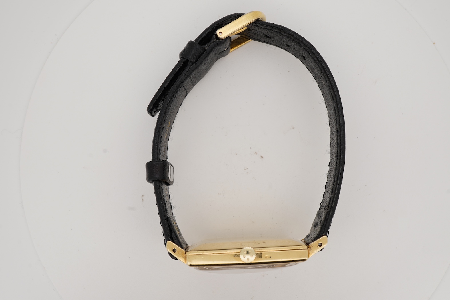 A gentleman's 18ct gold Eterna-Matic 3000 wrist watch, with baton hour marker, centre seconds hand and calendar aperture at 3 o’clock, on an associated black leather strap